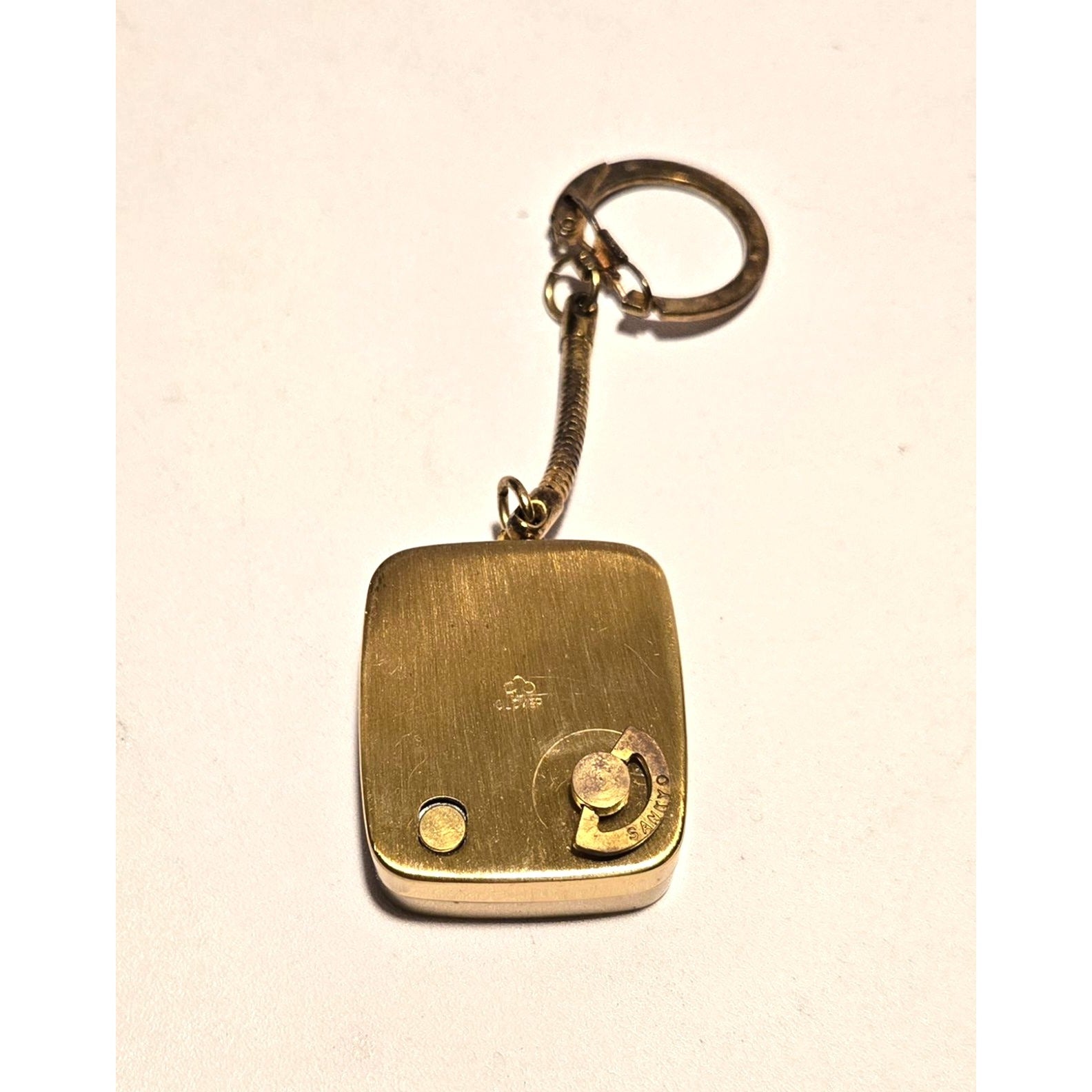 Vintage Brushed brass music box keychain, brand Clover, Jewish Star of David, plays Hava Nagila