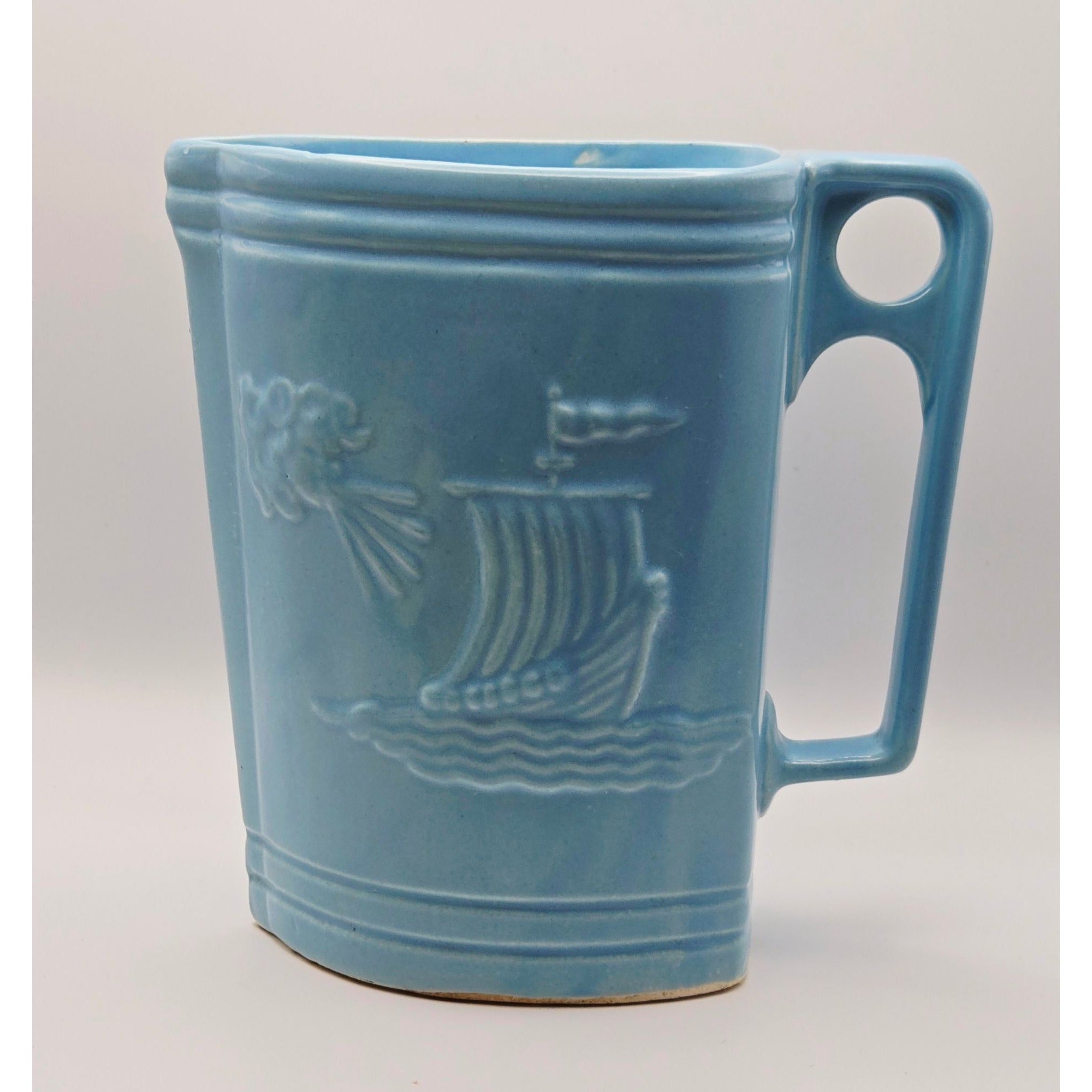 Vintage Ransbottom Blue Pottery Pitcher With Embossed Viking Ship & Wind Face Design