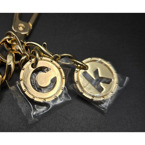 Calvin Klein Gold-Tone Logo Keychain purse charm With Decorative Charms & Lobster Clasp 4"